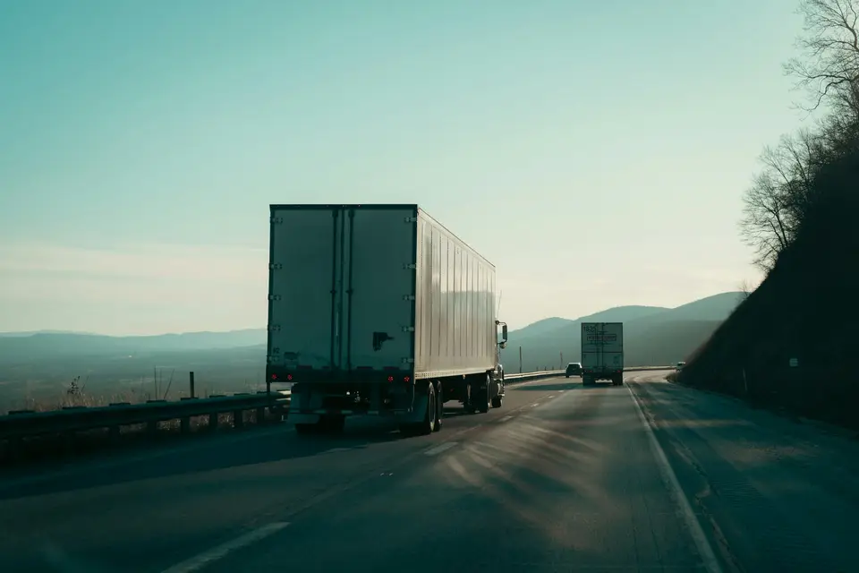 Freight trucks travelling along a highway